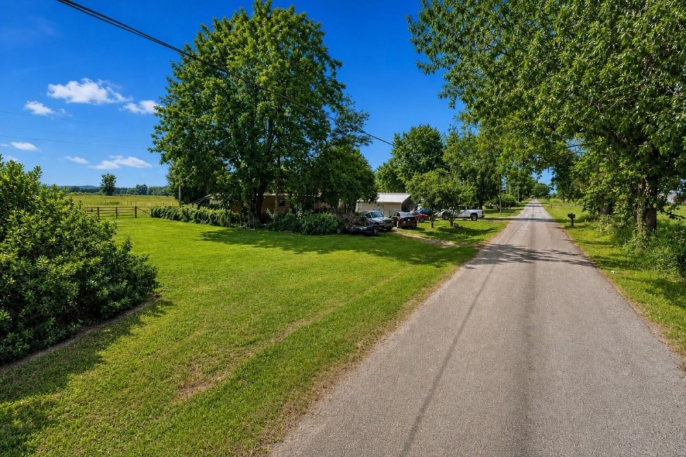 Rural property view under a clear blue sky