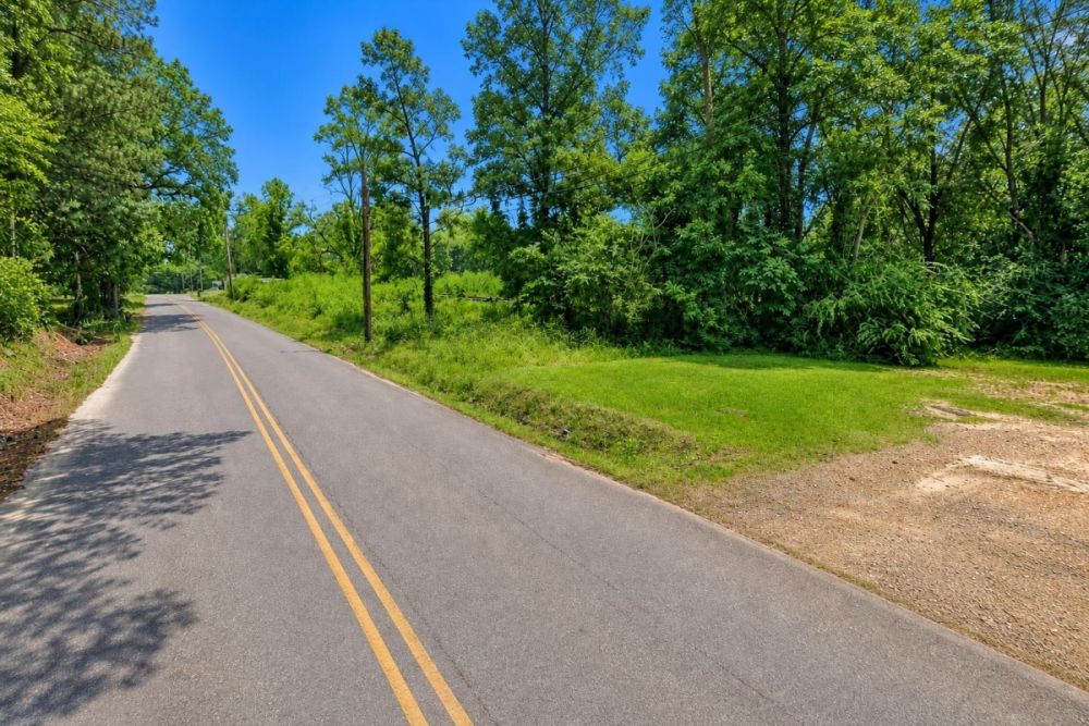 Rural property scene beneath a clear blue sky